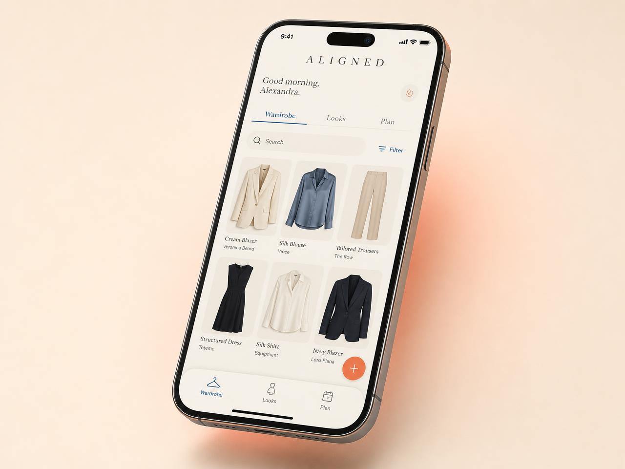 The ALIGNED app showing a curated digital wardrobe on a phone screen